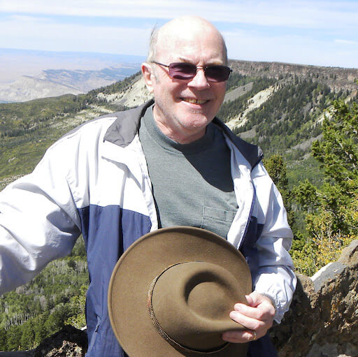 man photo holding hat